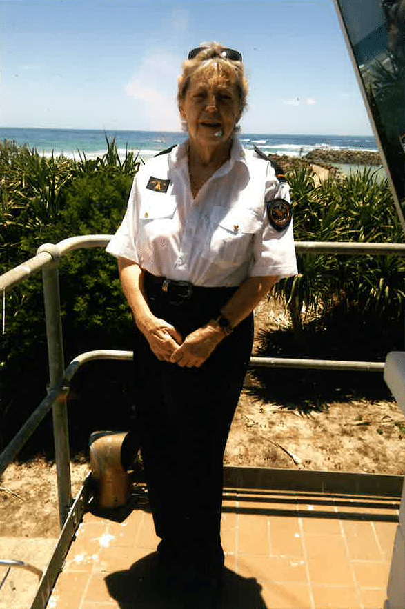 older lady in Salvation Army volunteer uniform at Kingscliff beach